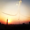 Egyptian air force jets perform stunts over downtown Cairo