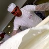 Turkish baklava baker at work. He’s rolling the newspaper-thin dough – one of 46 layers.