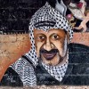 Memorial to Yasser Arafat on a wall in Jericho.