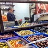 Two guys chewing the fat in an olive shop in Jerusalem.